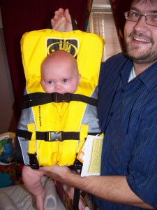 Doesn\'t Eva look comfy chewing on her baby-sized life jacket?
